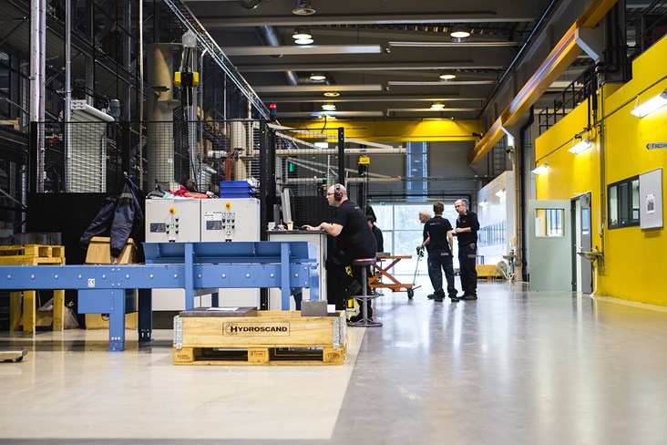 Employees working with custom blocks at the factory in Kongsberg, Norway