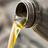 Image of biodegradable hydraulic oil pouring from a canister