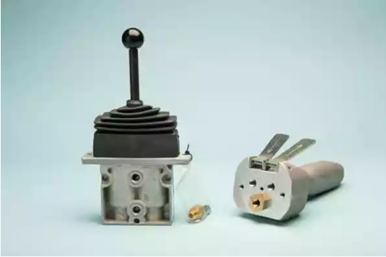 A close-up image of remote controls for an air motor