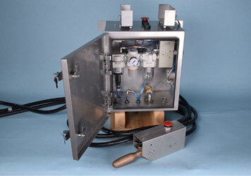 A close-up image of a control cabinet and air treatment system, highlighting the various components.