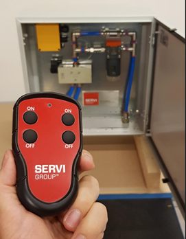 Et bilde av et pneumatisk system med håndholdt kontroll.