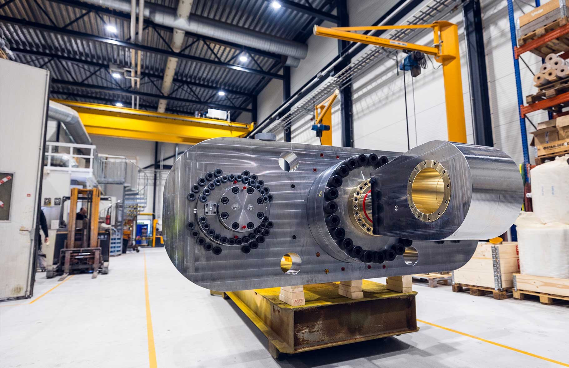 Large crankshaft shock absorber ready to be lifted in the production hall in Rissa
