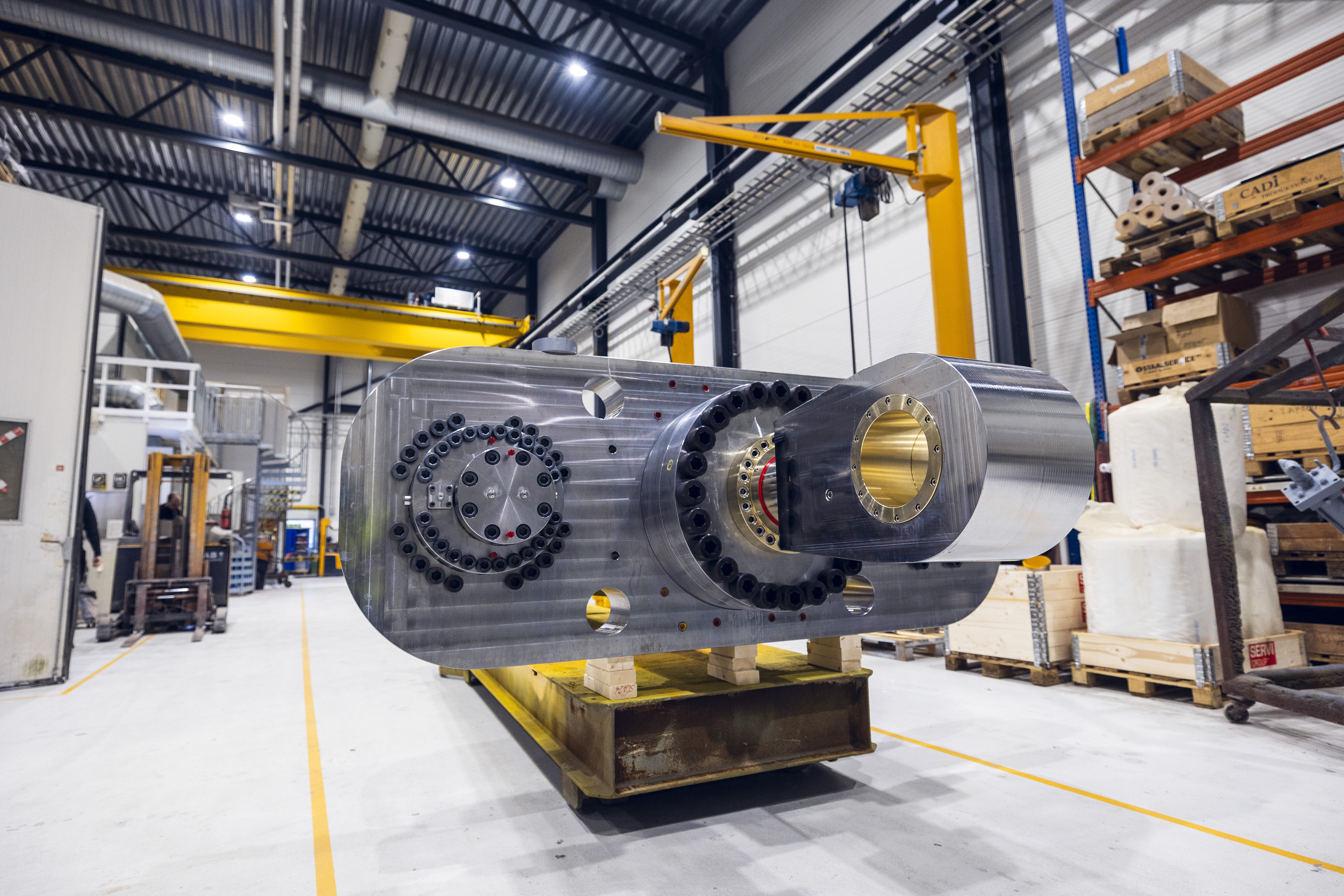Large crankshaft shock absorber ready to be lifted in the production hall in Rissa